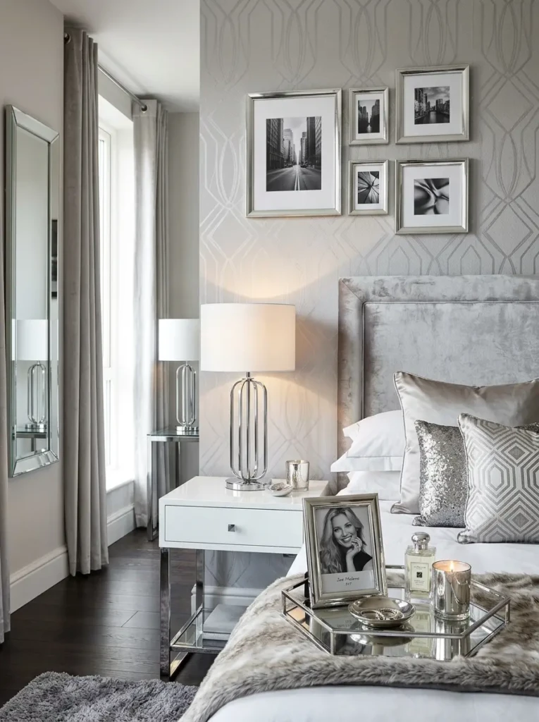 Silver frames, chrome lamps, and mirrored decor styled in a trendy Y2K bedroom.